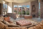 The open-plan living area on the main level is elegant and spacious with floor to ceiling windows